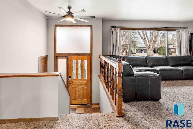 interior space with ceiling fan and carpet