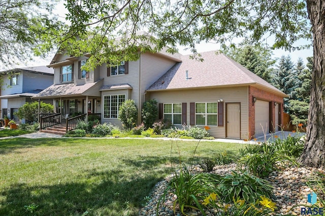 view of front facade with a front lawn, a garage, and a porch