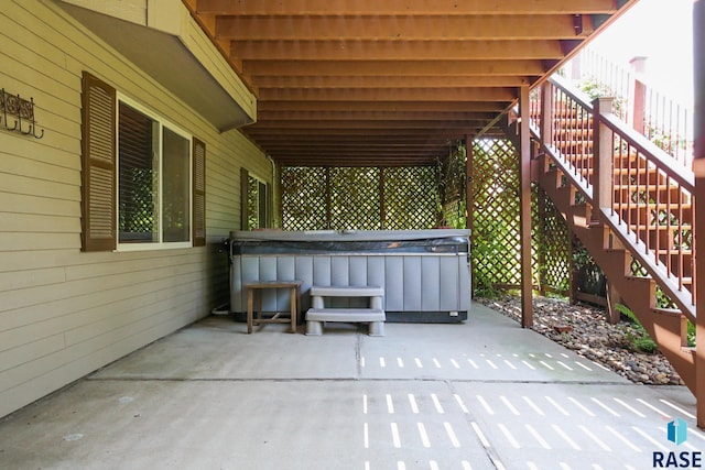 view of patio with a hot tub