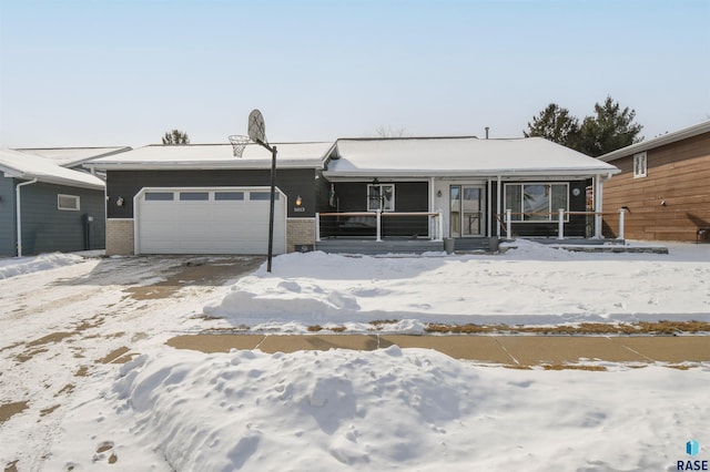 view of front of property featuring covered porch, brick siding, and an attached garage