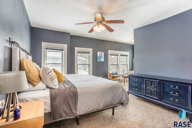 bedroom with ceiling fan and carpet