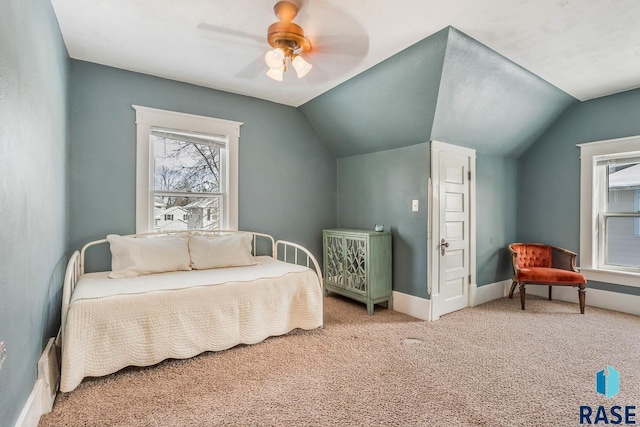 bedroom featuring baseboards, vaulted ceiling, carpet, and ceiling fan