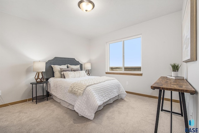 bedroom with carpet and baseboards