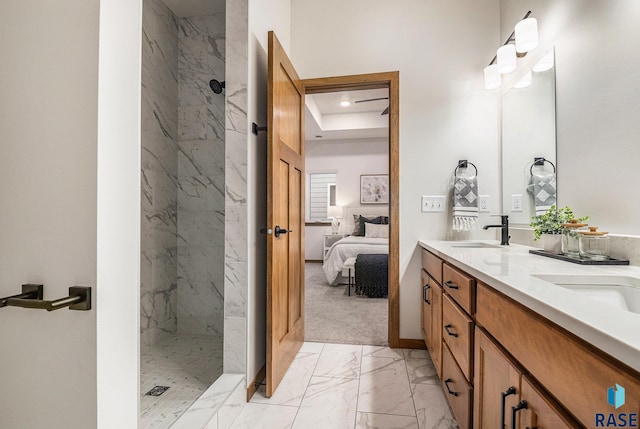 bathroom featuring ensuite bathroom, a sink, marble finish floor, a marble finish shower, and double vanity