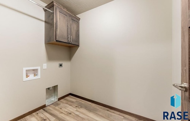 laundry room with light wood-style flooring, washer hookup, baseboards, cabinet space, and electric dryer hookup