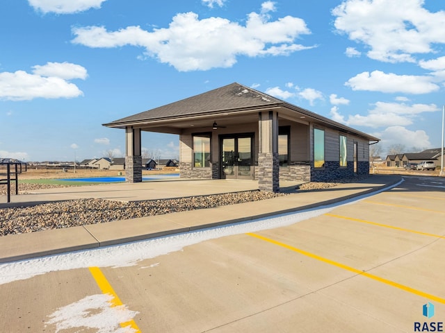 view of home's community with a patio area