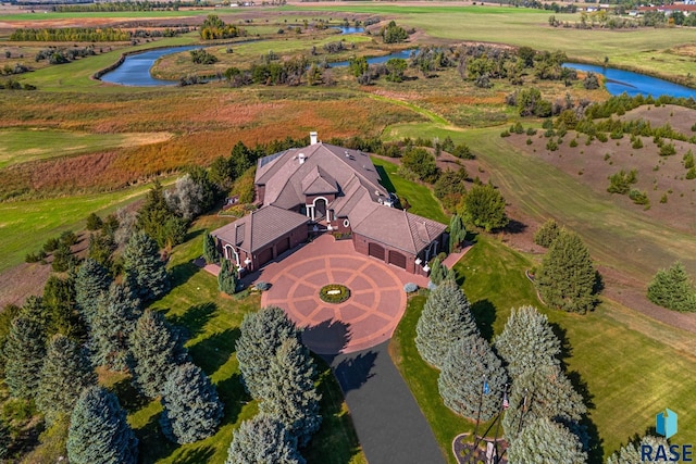 drone / aerial view with a water view and a rural view