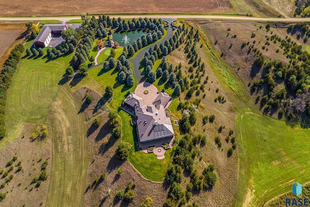 aerial view with a rural view and a water view