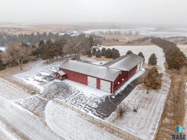 snowy aerial view with a rural view