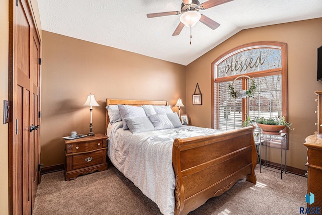 bedroom with light carpet, baseboards, ceiling fan, vaulted ceiling, and a textured ceiling