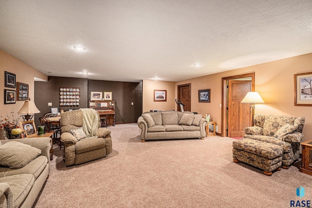 carpeted living room featuring recessed lighting and a textured ceiling