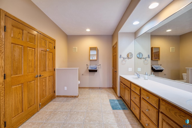 full bath with baseboards, toilet, tile patterned flooring, vanity, and recessed lighting