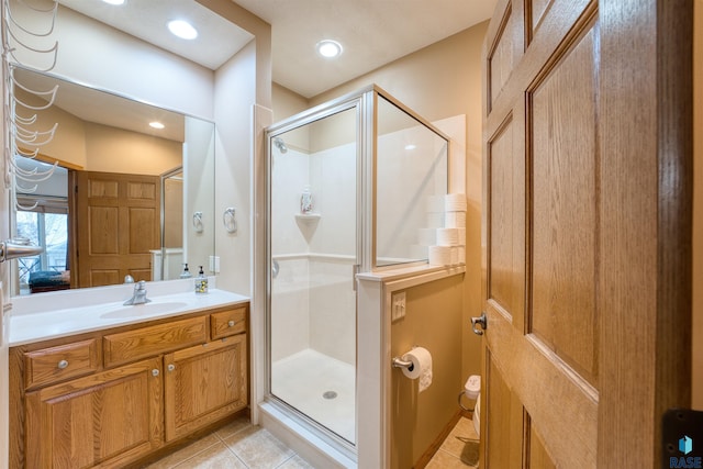 bathroom with tile patterned flooring, a shower stall, vanity, and recessed lighting