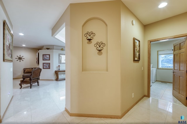 hall with baseboards, light tile patterned flooring, and recessed lighting