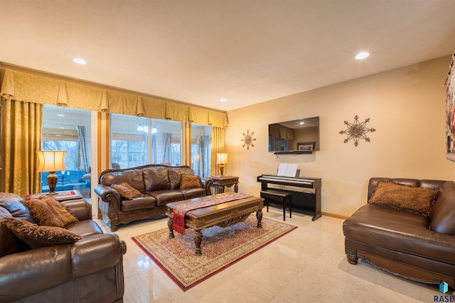 living area with recessed lighting and baseboards