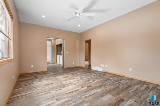 spare room featuring recessed lighting, light wood-type flooring, visible vents, and baseboards