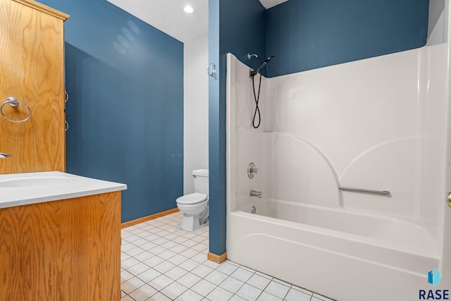 bathroom with shower / washtub combination, toilet, vanity, tile patterned flooring, and baseboards