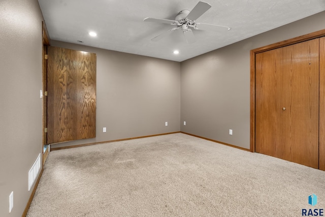 unfurnished room with baseboards, recessed lighting, a ceiling fan, and light colored carpet