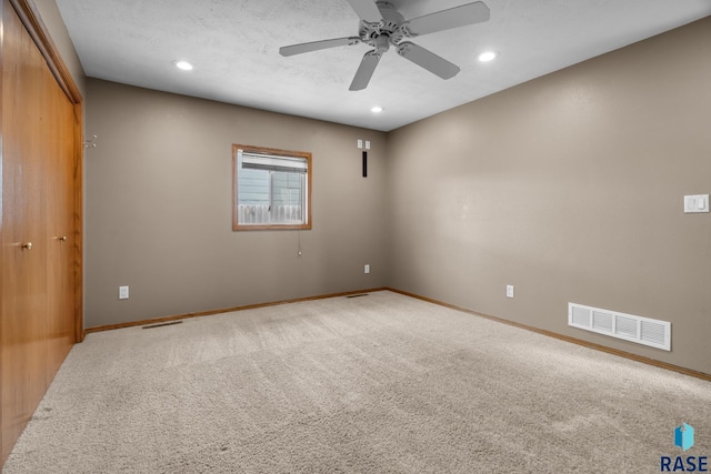 empty room with recessed lighting, baseboards, visible vents, and carpet flooring