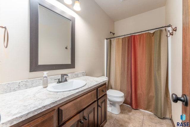 full bathroom featuring toilet, curtained shower, tile patterned flooring, and vanity