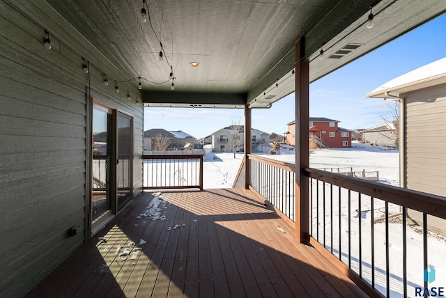 wooden terrace with a residential view