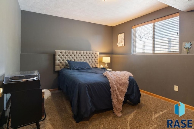 carpeted bedroom with baseboards