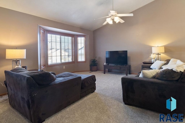 living room featuring a ceiling fan, lofted ceiling, and light colored carpet