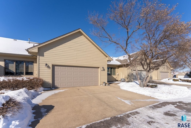 view of front of property with driveway and an attached garage