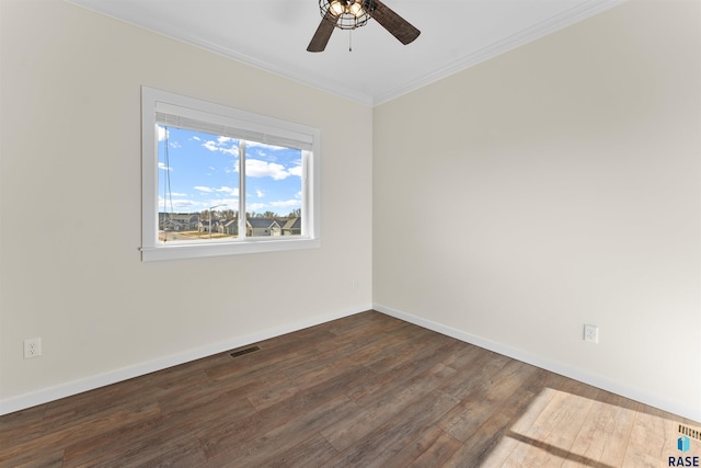 empty room featuring a ceiling fan, baseboards, visible vents, dark wood-style floors, and crown molding