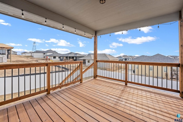 wooden terrace featuring a residential view