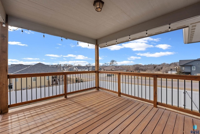 wooden deck featuring a residential view