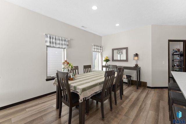 dining area featuring light wood-type flooring, visible vents, baseboards, and recessed lighting