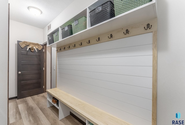 mudroom with visible vents and light wood-style flooring