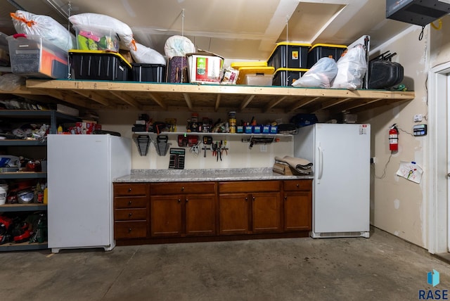 garage with freestanding refrigerator