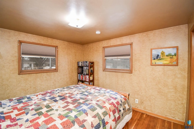 bedroom featuring wood finished floors