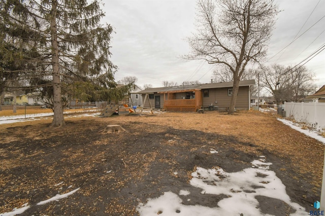 back of property with fence