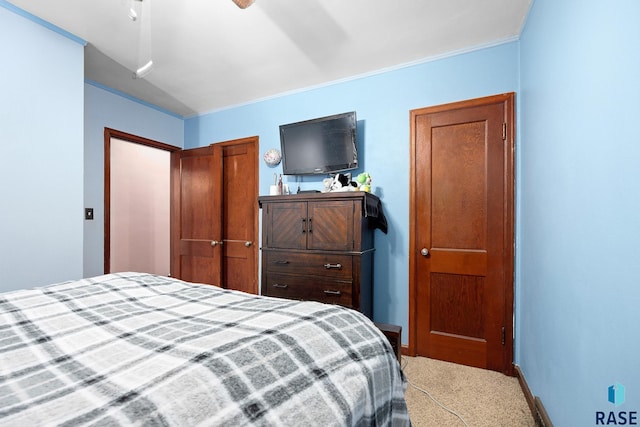 bedroom with carpet flooring and baseboards