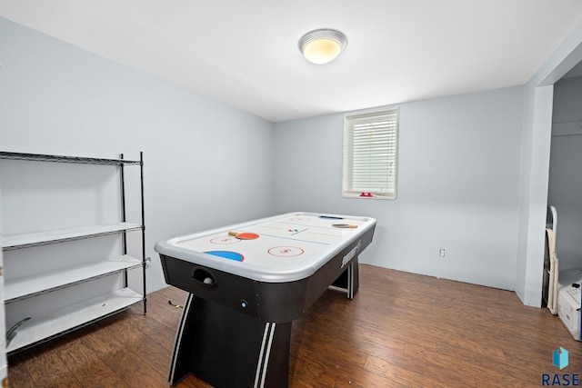 recreation room featuring dark wood finished floors