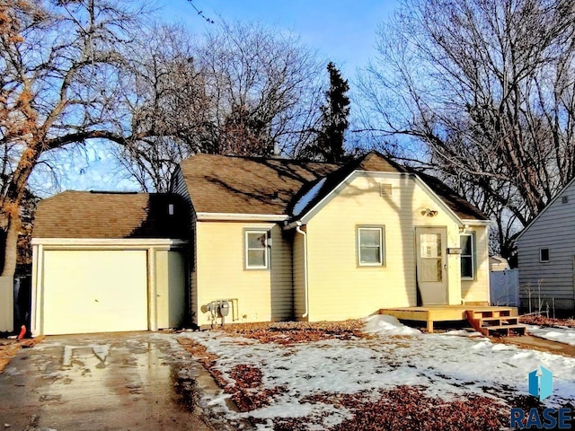 ranch-style house featuring driveway and a garage