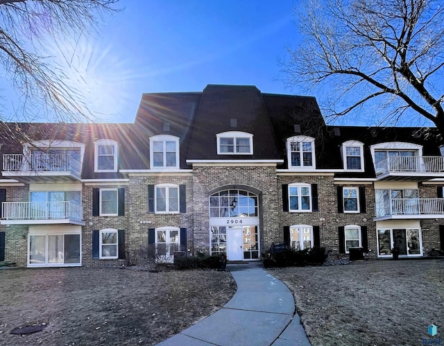 view of front of property featuring brick siding