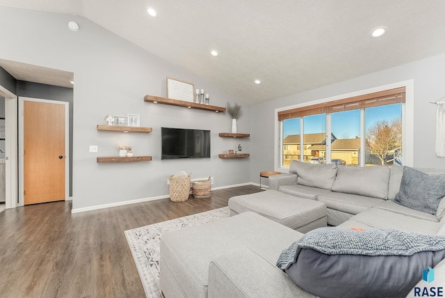 living area featuring recessed lighting, vaulted ceiling, baseboards, and wood finished floors