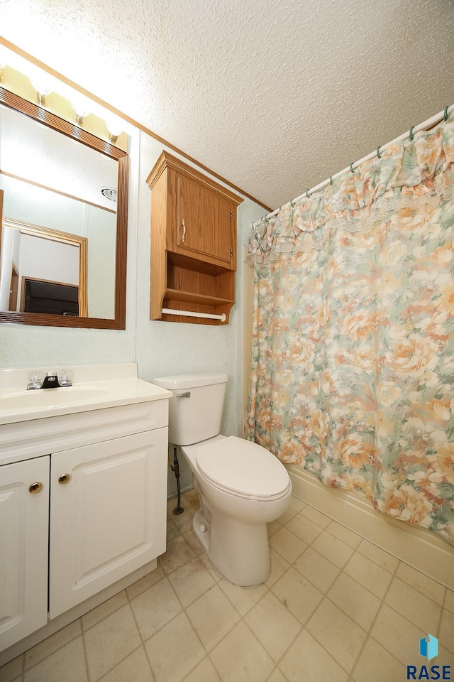 bathroom featuring shower / tub combo with curtain, toilet, a textured ceiling, vanity, and tile patterned floors