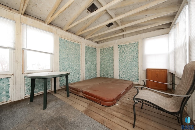 sunroom with lofted ceiling