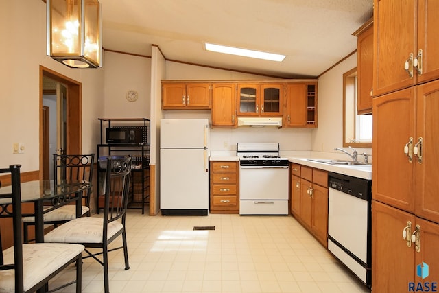 kitchen featuring under cabinet range hood, white appliances, a sink, light countertops, and glass insert cabinets