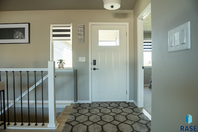 entryway featuring baseboards