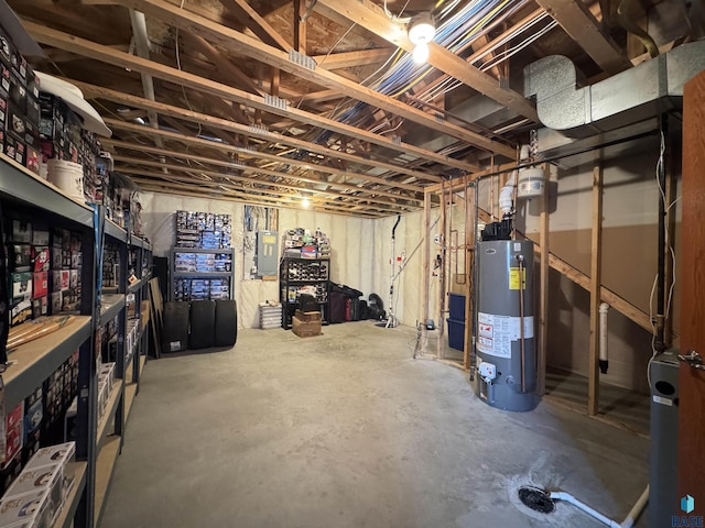 unfinished basement featuring gas water heater and electric panel