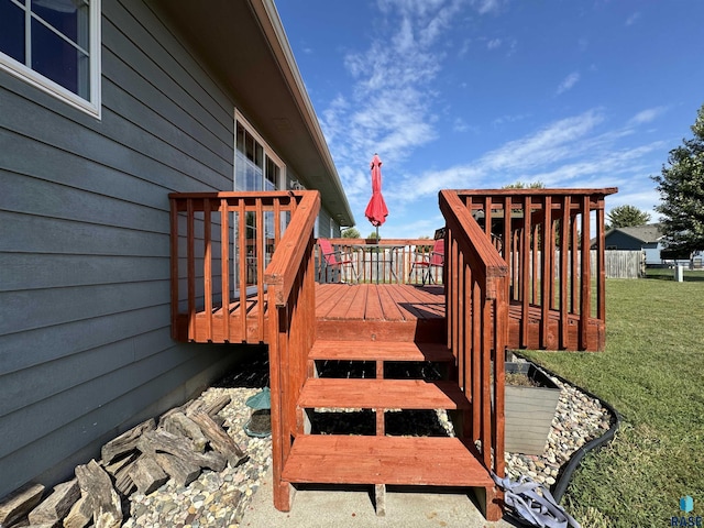 deck featuring a yard