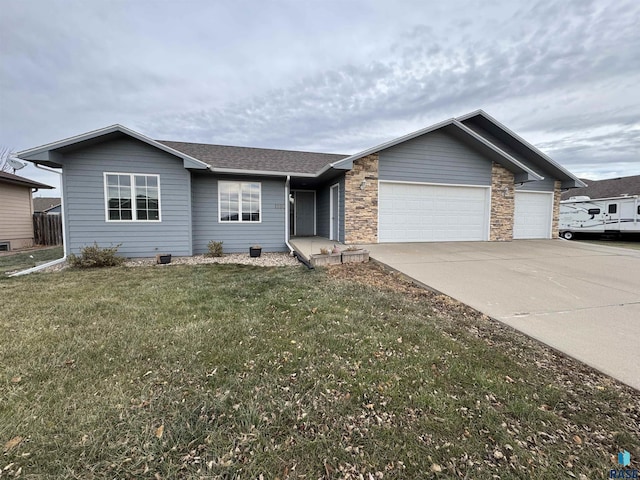 ranch-style house featuring a garage, a shingled roof, driveway, stone siding, and a front yard