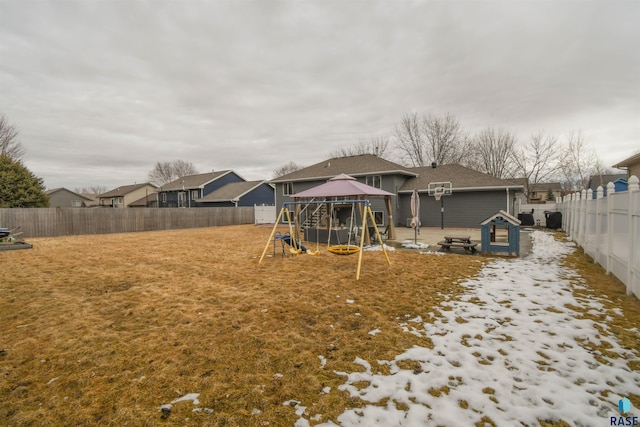 view of yard with a residential view, a playground, a fenced backyard, and a gazebo