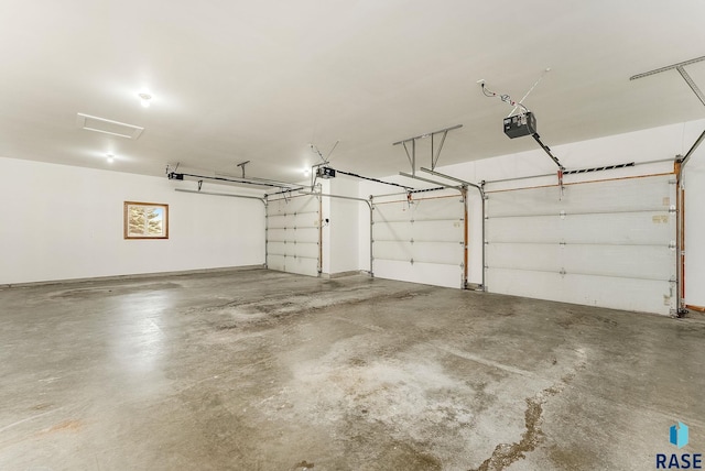 garage featuring a garage door opener